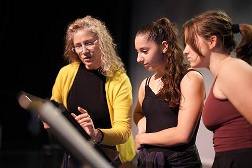 A faculty member teaches Converse theatre students.